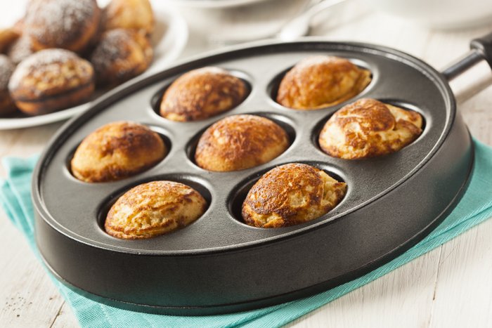 Ebelskivers in a pan baking