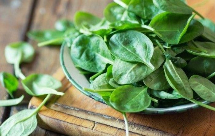 Spinach on a wood board
