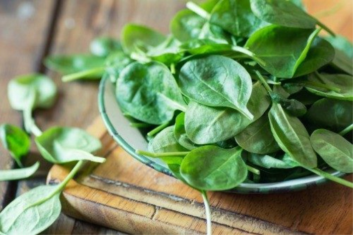 Spinach on a wood board