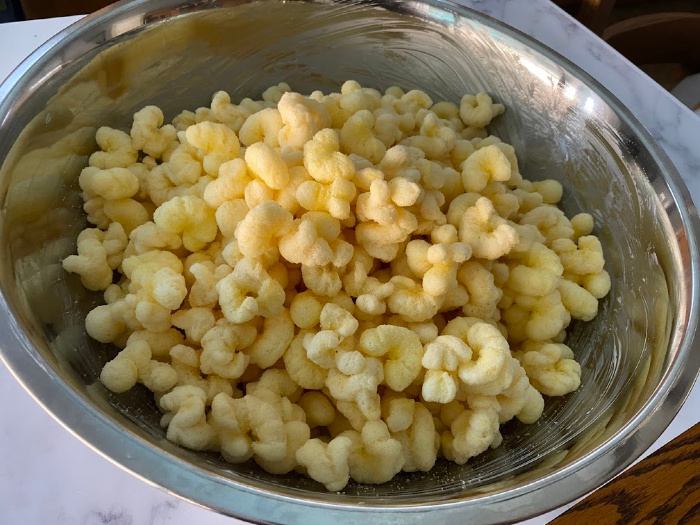 Corn Pops in a buttered bowl