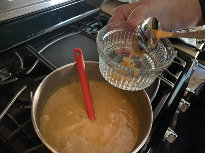 Drop a spoonful of caramel in a bowl of cold water