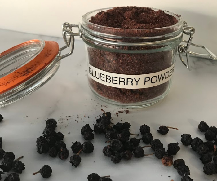 Dehydrated blueberries that have been ground up in the blender to make powder