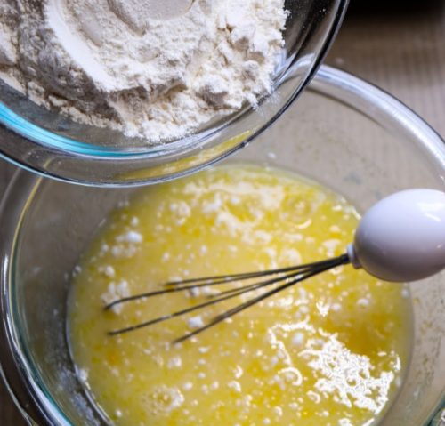 Adding the flour mixture to the egg mixture