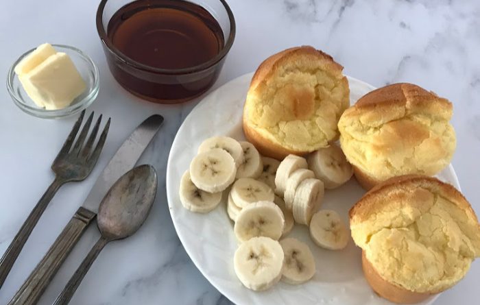 Serving Popeye Pancakes with bananas and syrup