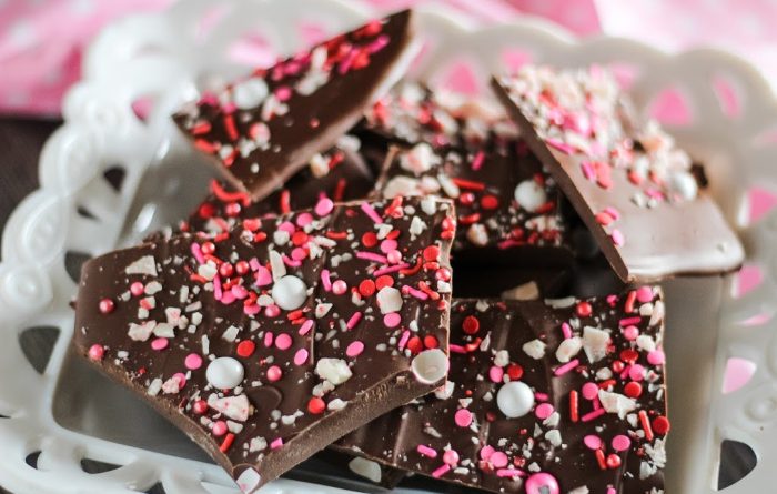 Chocolate bark chunks on a white plate