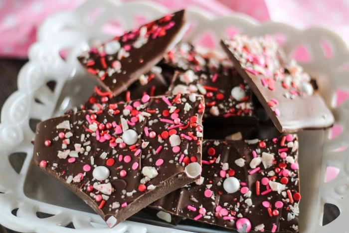 Chocolate bark chunks on a white plate