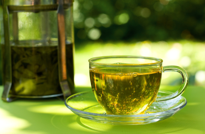 Green Tea Steeping in a cup ready to drink