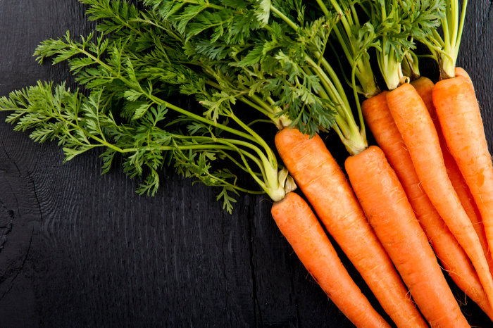 Imperator Carrots on a wooden plank