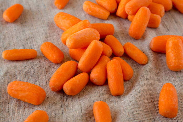 Baby Carrots laying on a cloth
