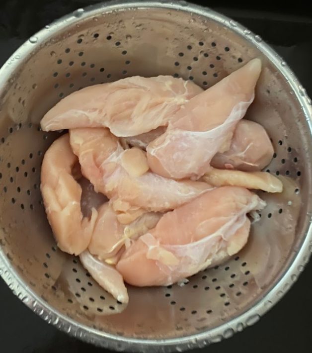 Chicken Tenderloins Being Rinsed