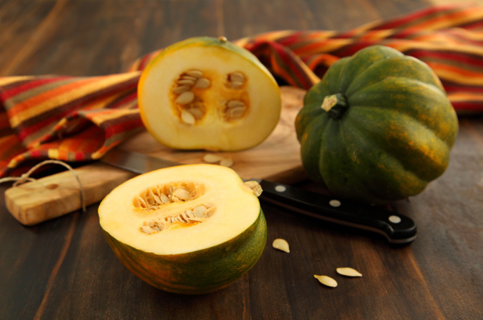 Acorn squash on a wooden board