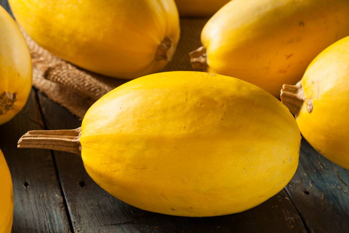 Yellow Spaghetti squash on a wooden board