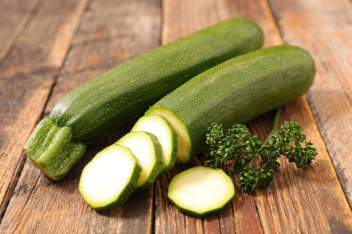 Zucchini squash on a wooden plank