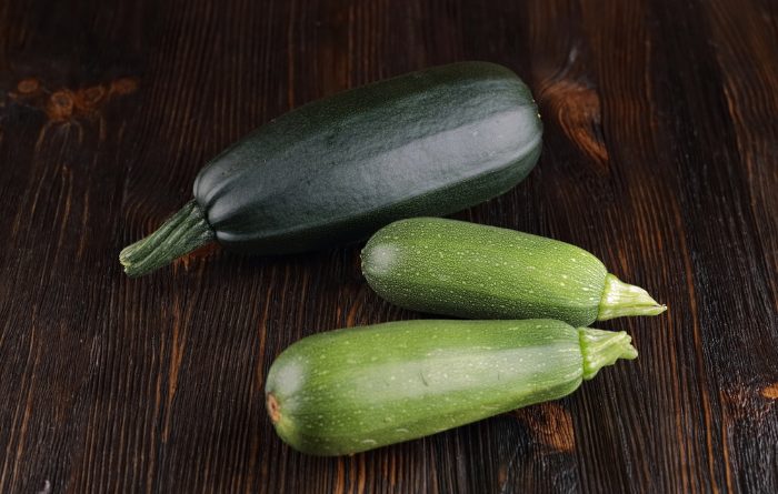 Squash laying on a wooden board