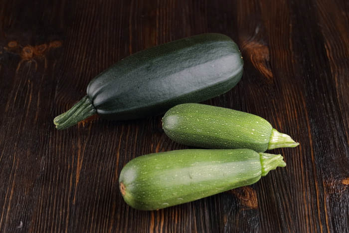 Squash laying on a wooden board