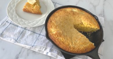 Cornbread cut and on a white plate