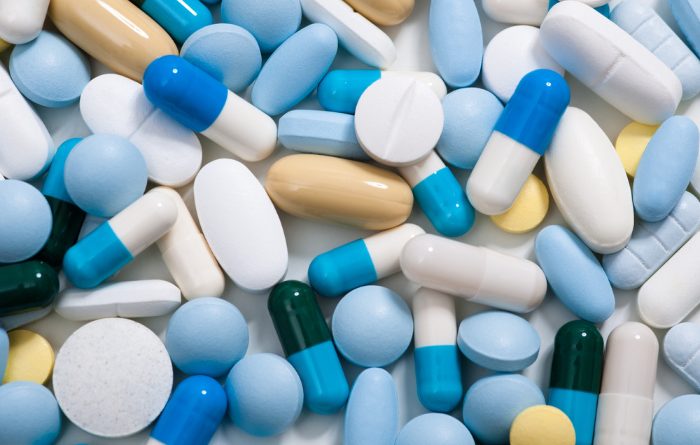 Antibiotic pills spread out on counter