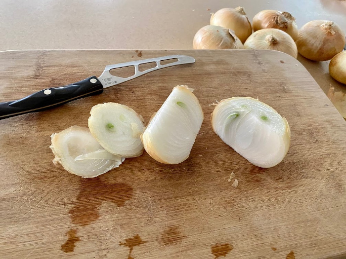 Cutting onions a chopping board