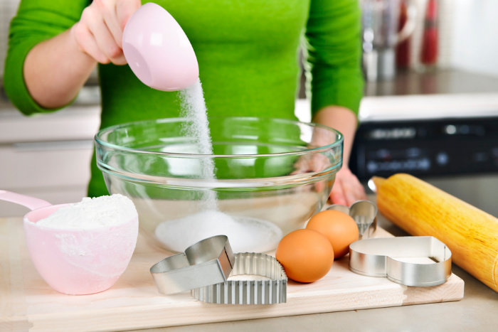 Pouring Sugar into a bowl