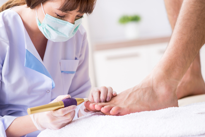 Podiatrist Treating Patient