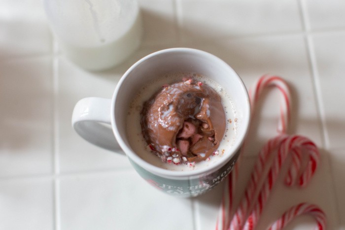 Pour Steaming Milk Over The Cocoa Bomb