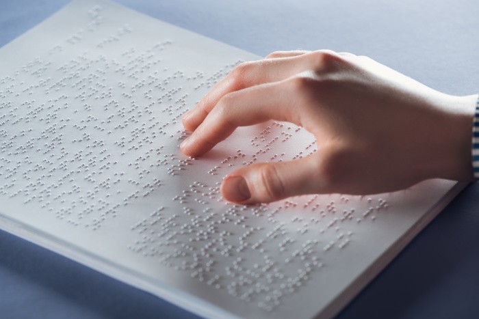 Braille Text with Hand