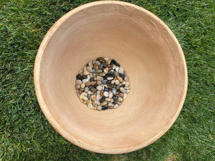 Fill pot with rocks