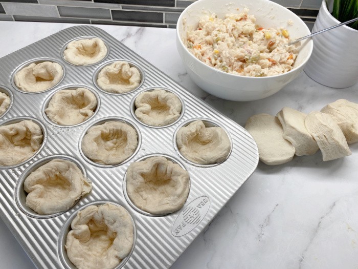 Push Biscuits in Muffin Tins