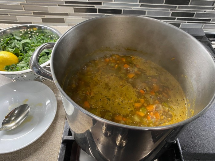 Scoop Ingredients Into Soup Pot