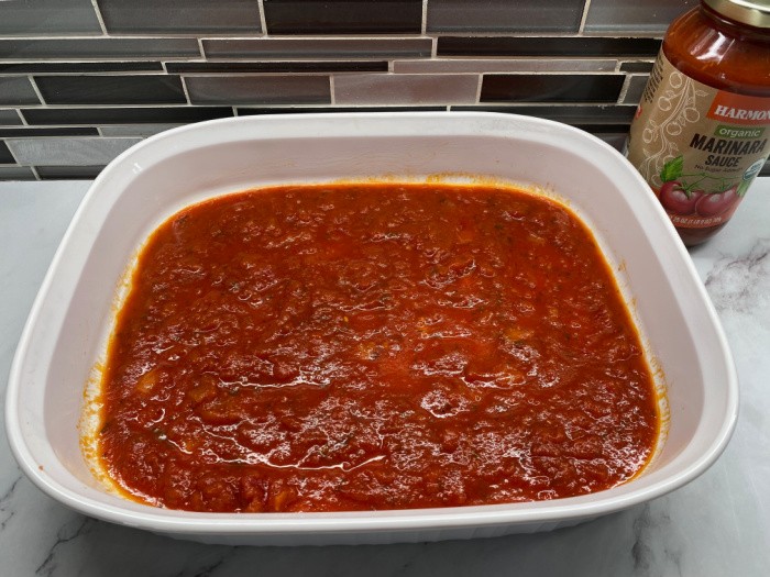 Spread some of the Sauce into pan
