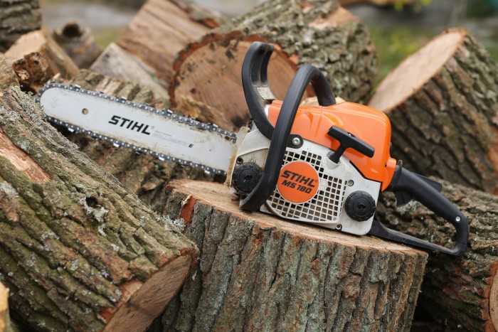 Oak Firewood being Cut with a Chainsaw