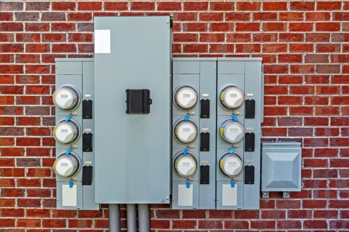 Electric Meters on Red Brick Wall