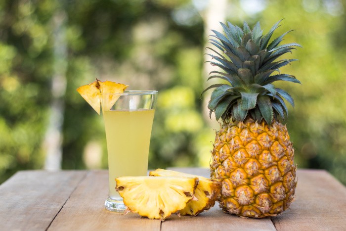 Pineapple Juice With Green Background