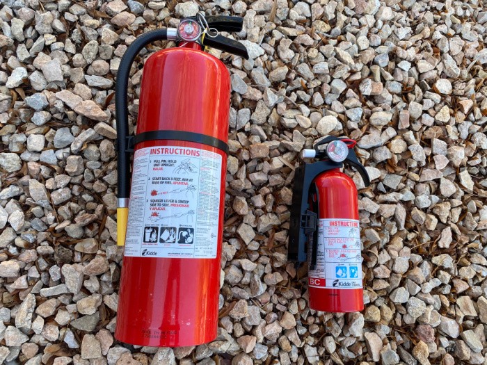 Fire Extinguishers Laying on some Rocks