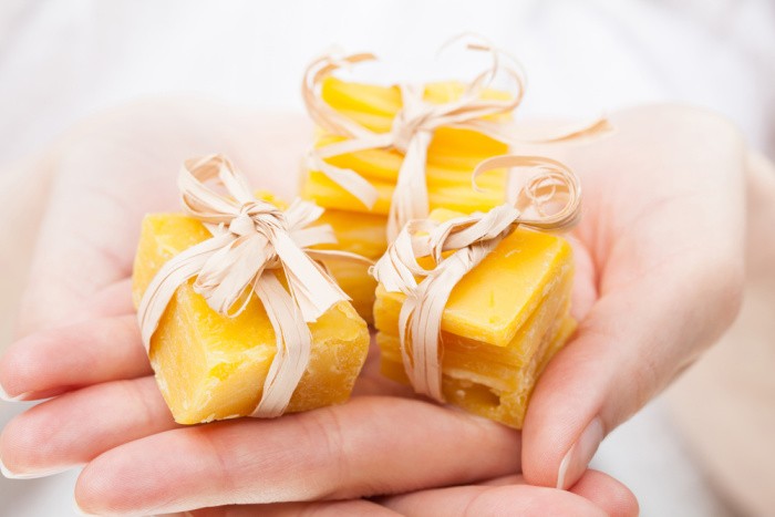 Beeswax in Woman's Hands