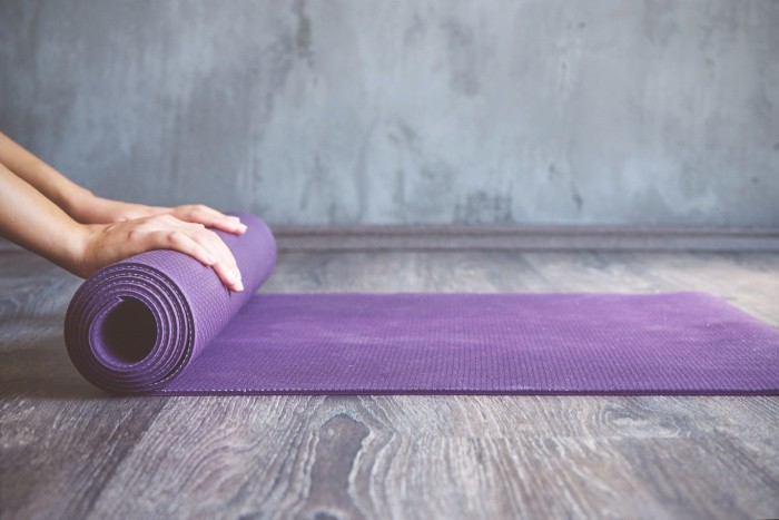 Woman with Yoga Mat