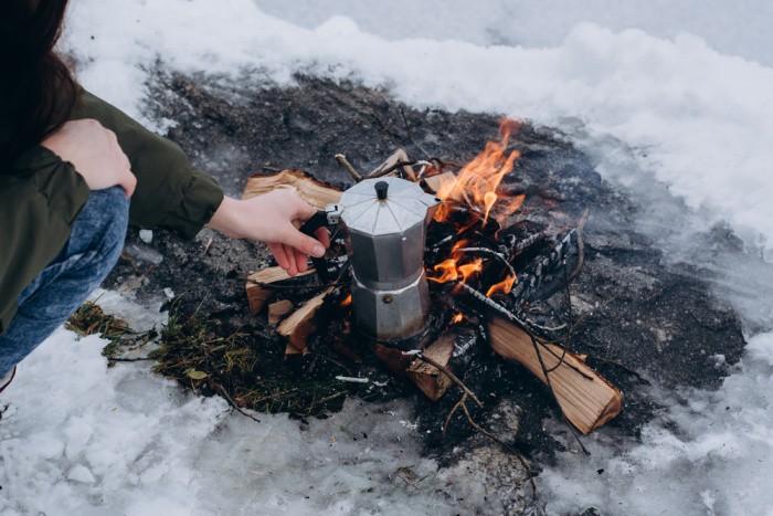 Cooking Coffee Outside Woman Holding Cup