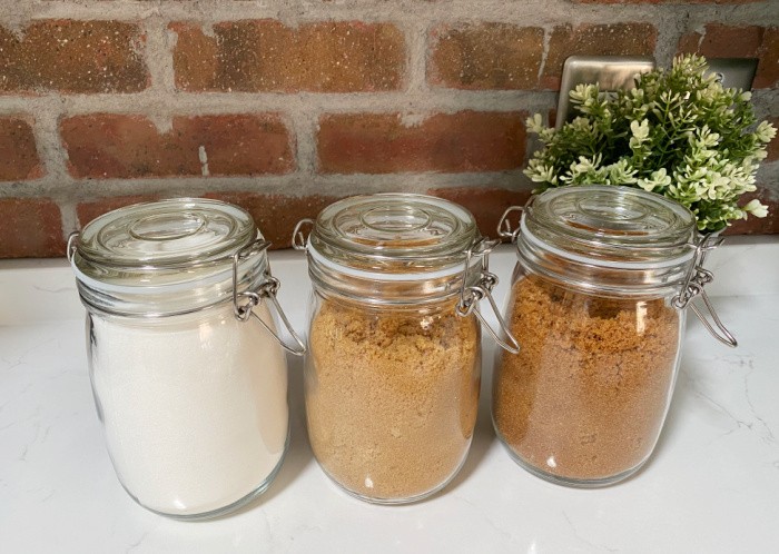 Brown and White Sugar In Jars