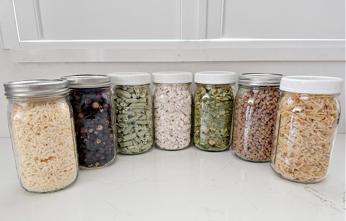 Mason Jars Lined Up On The Countertop