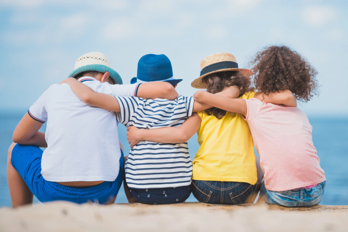 Children Sitting Seaside