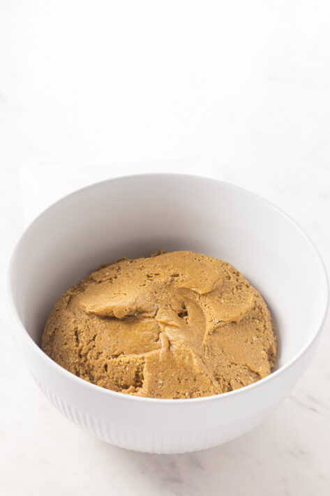 The formed dough ball made of peanut butter oat flour base for no bake peanut butter bars.